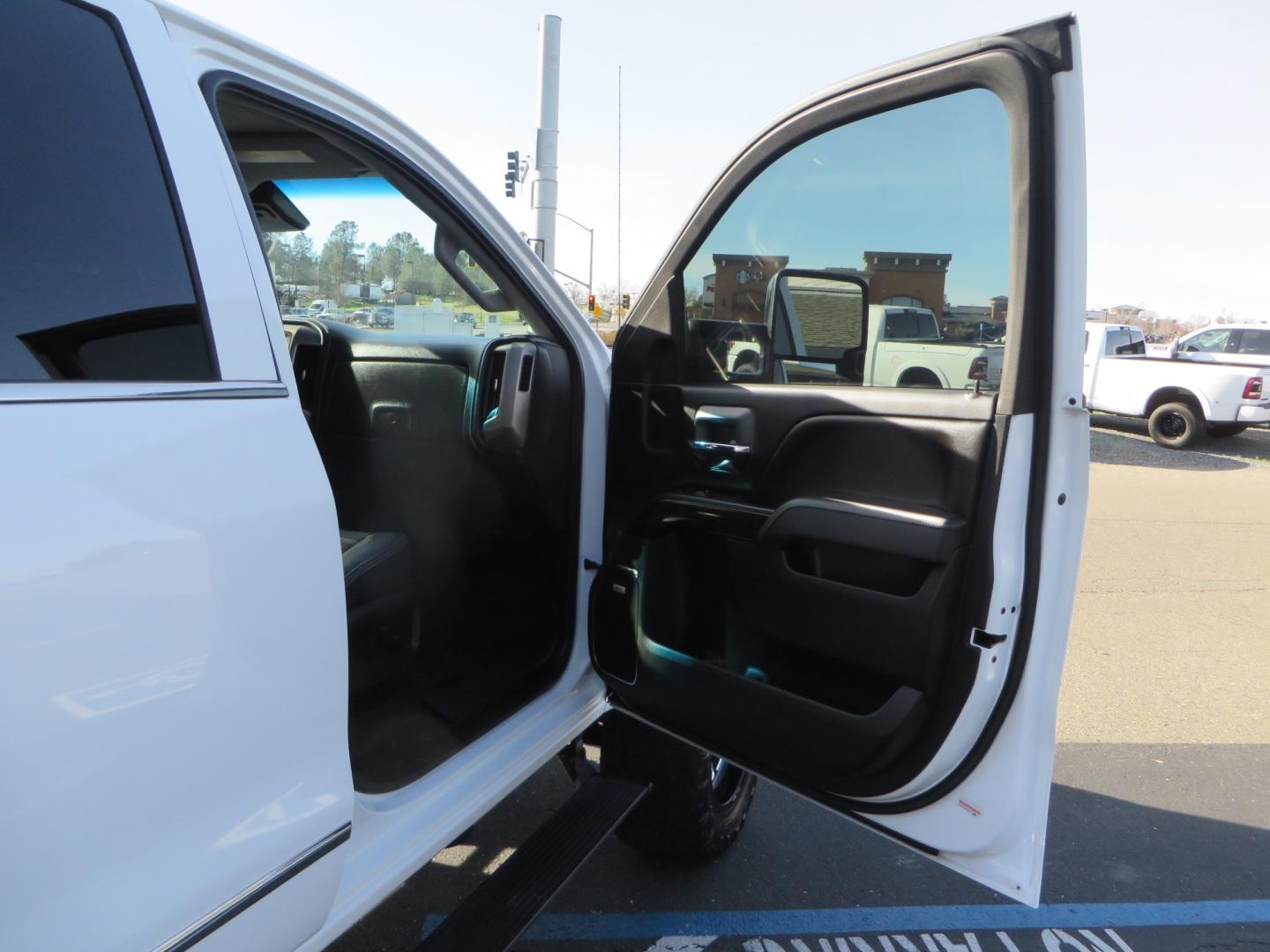 2015 White GMC Sierra 2500 HD Crew Cab Denali (1GT120E88FF) with an V8 Turbo Dsl 6.6L engine, Auto 6-Spd Allison OD transmission, located at 2630 Grass Valley Highway, Auburn, CA, 95603, (530) 508-5100, 38.937893, -121.095482 - 2015 GMC Denali 2500 6.6L Duramax Diesel. Cognito 4-6" lift kit, Cognito traction bars, Cognito idler and pitman support, Kryptonite upper control arms, Fox remote reservoir shocks, Amp power steps, Fuel Offroad wheels, Nitto Ridge Grappler tires, Alpine Stereo Firestone ride rite air bags, Transfer - Photo#42